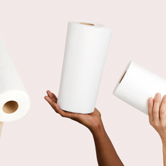 Three hands holding bamboo paper towels