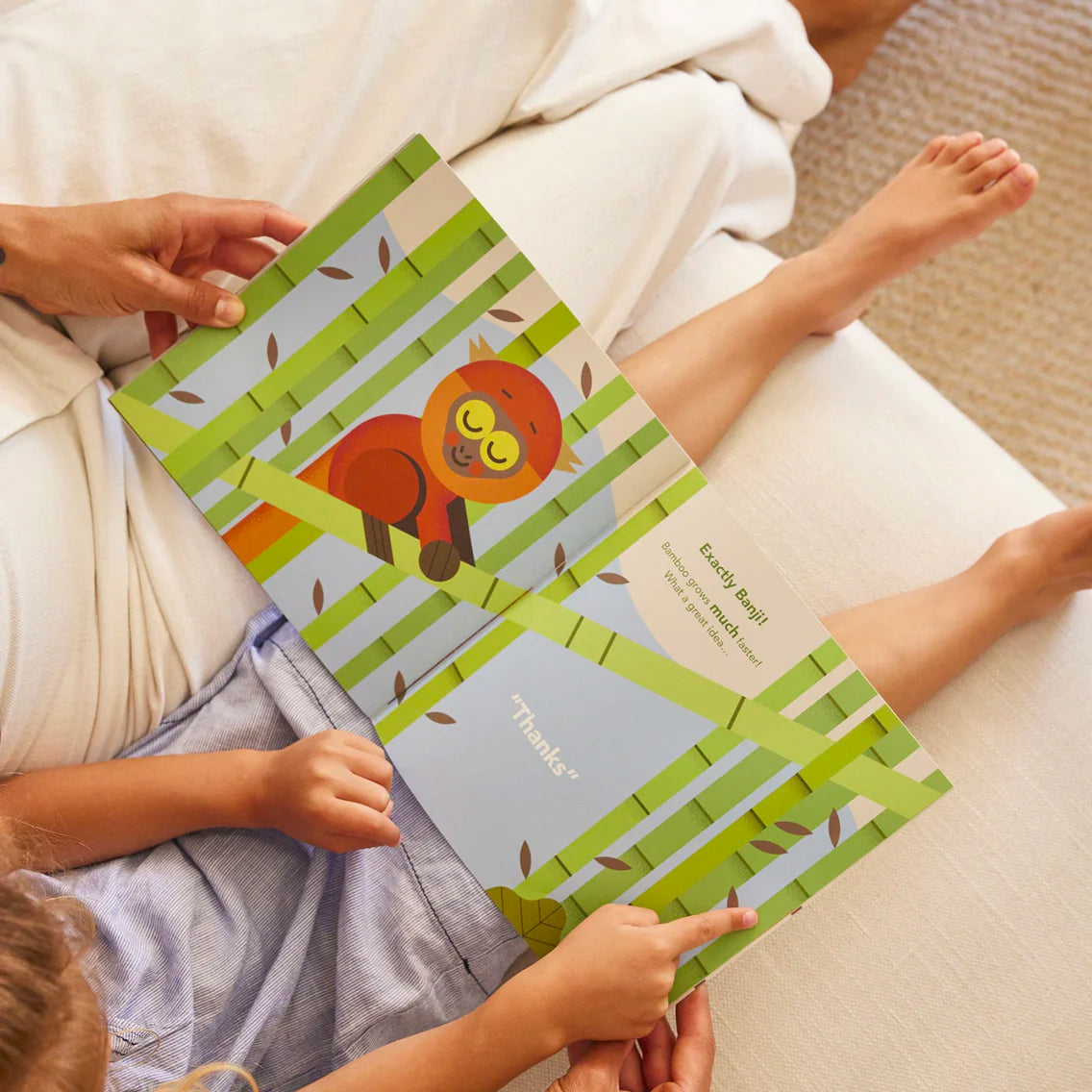 A parent and you child reading Banji's Big Idea storybook